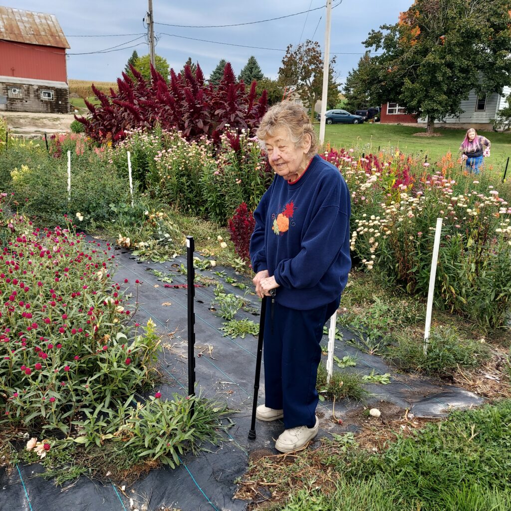 My mom at the home farm, now Wild Elements Flower Farm, at a Saturday morning market. wildelementswi.com